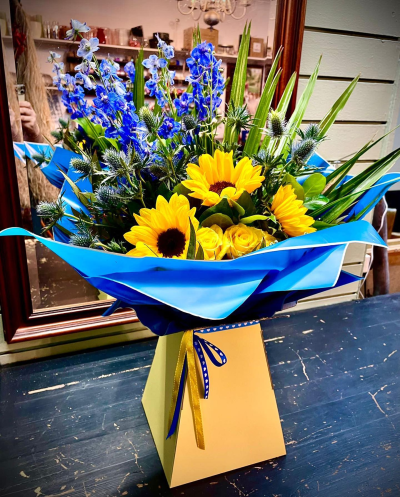 Sunrise - Energise their day with a stunning surprise. A warm collection of seasonal flowers artistically arranged by an artistic florist.